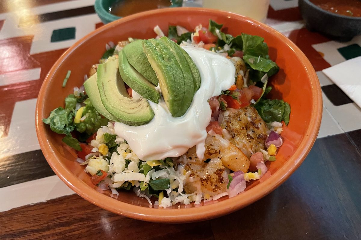 Burrito bowl with rice, beans, salsa and sour cream