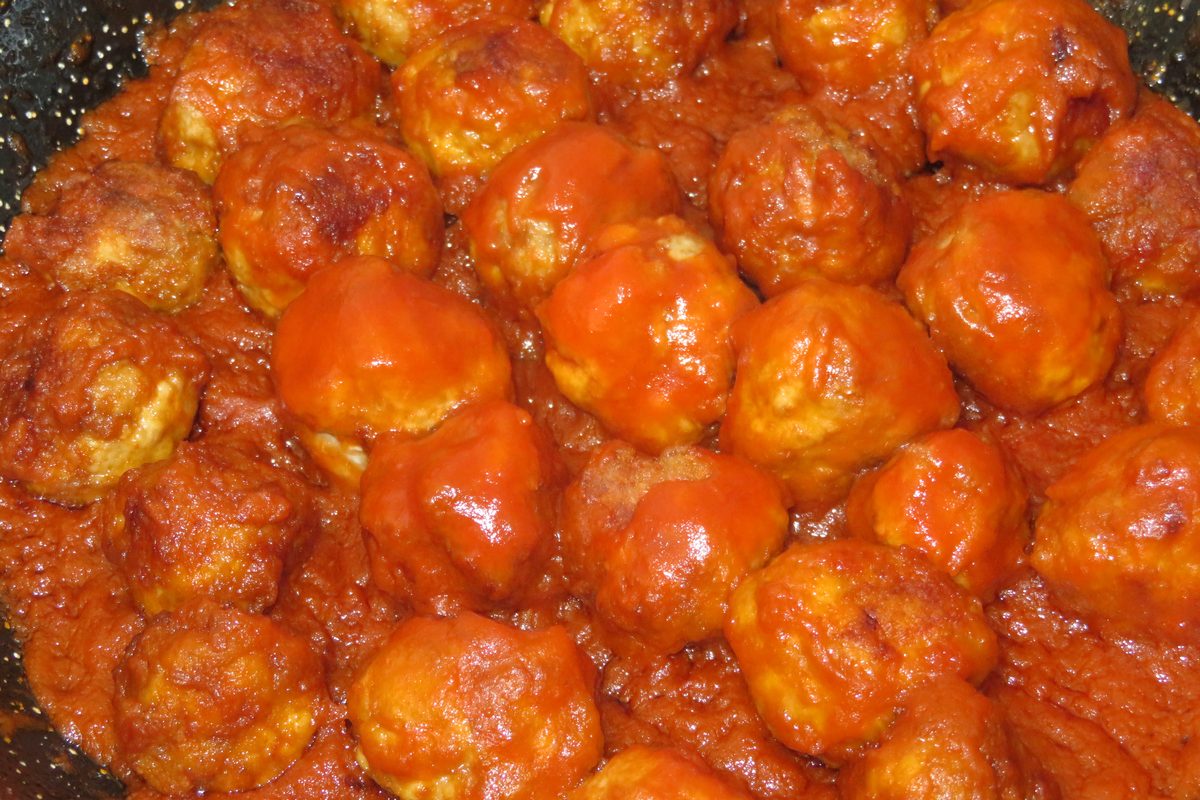 Turkey meatballs in tomato sauce in a skillet